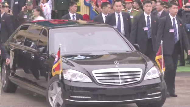 Kim Jong Un could be seen waving from inside a Mercedes stretch limo pulling away from the railway station, for the 100 mile drive to Hanoi.   