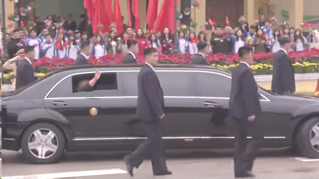 Kim Jong Un could be seen waving from inside a Mercedes stretch limo ...