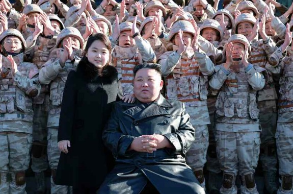 Kim Jong Un and his daughter took group photos with soldiers and scientists who contributed to last week's Hwasong-17 ICBM launch, state media reported Sunday. North Korea also awarded the launch vehicle the title of the DPRK Hero and promoted military officials