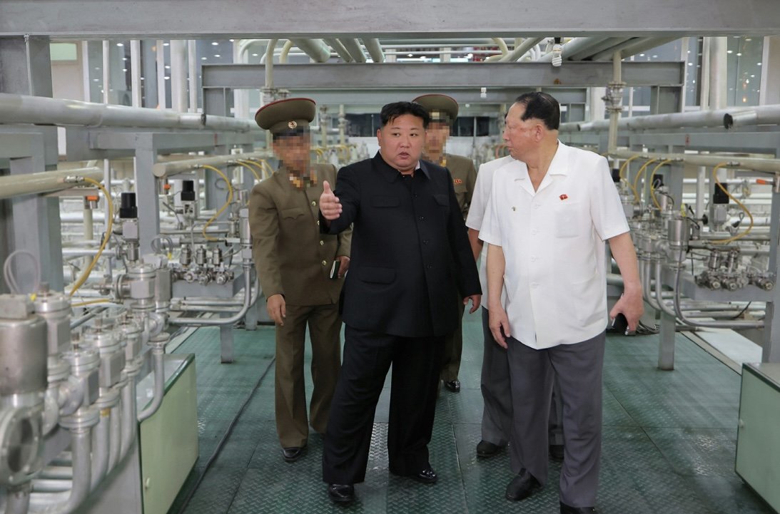 New pictures of Kim Jong Un inspecting a uranium enrichment facility: new centrifuges, and quite a bit of SWU visible