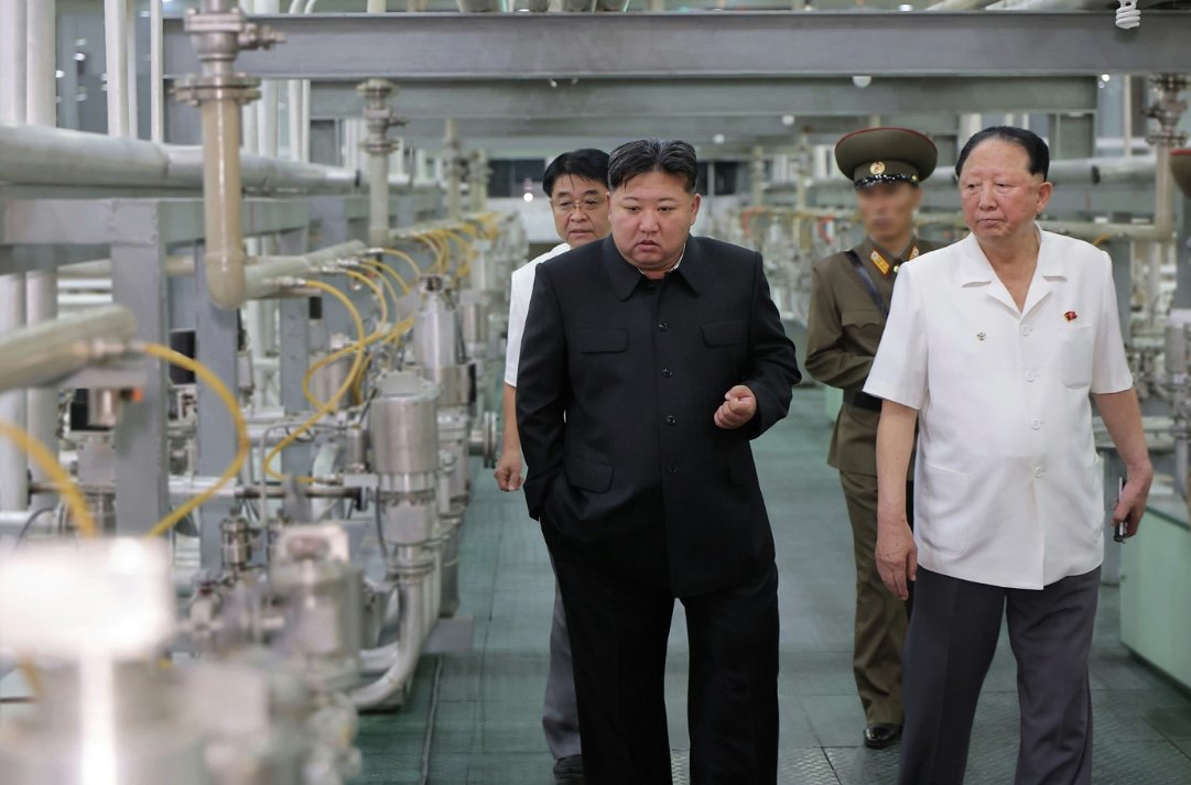 New pictures of Kim Jong Un inspecting a uranium enrichment facility: new centrifuges, and quite a bit of SWU visible