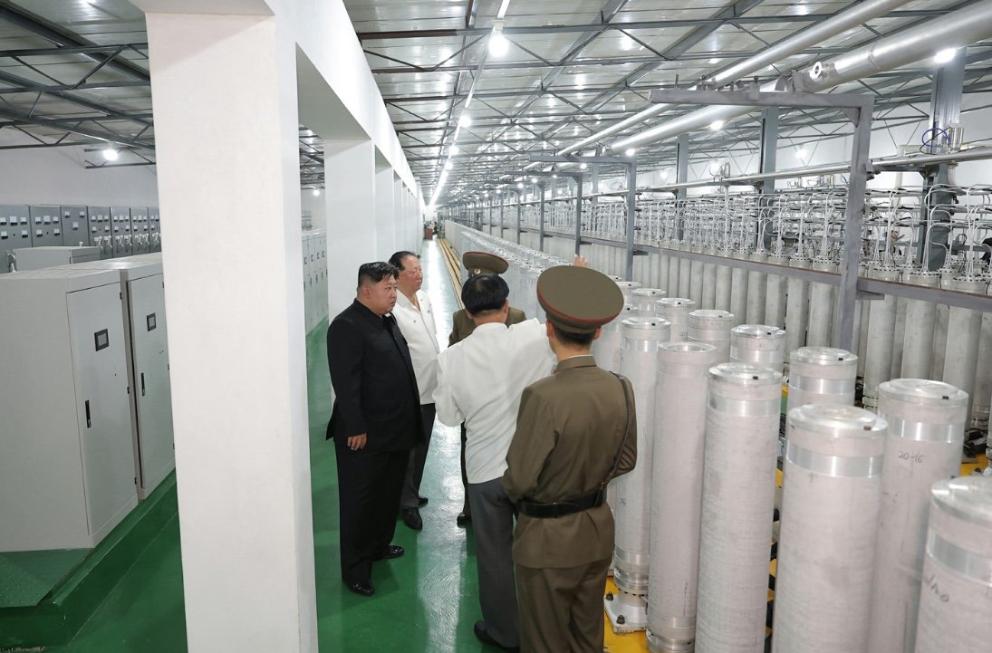 New pictures of Kim Jong Un inspecting a uranium enrichment facility: new centrifuges, and quite a bit of SWU visible