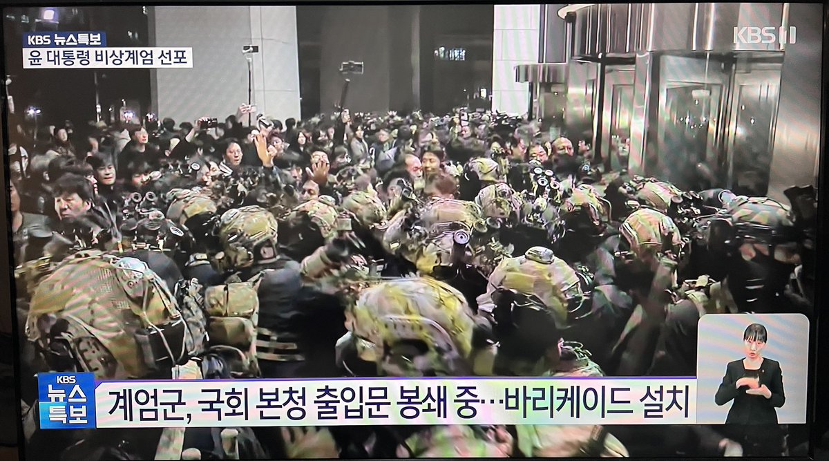 Cheers erupt as soldiers are pulling back from the building. For now, the South Korean people have successfully stopped soldiers from entering parliament